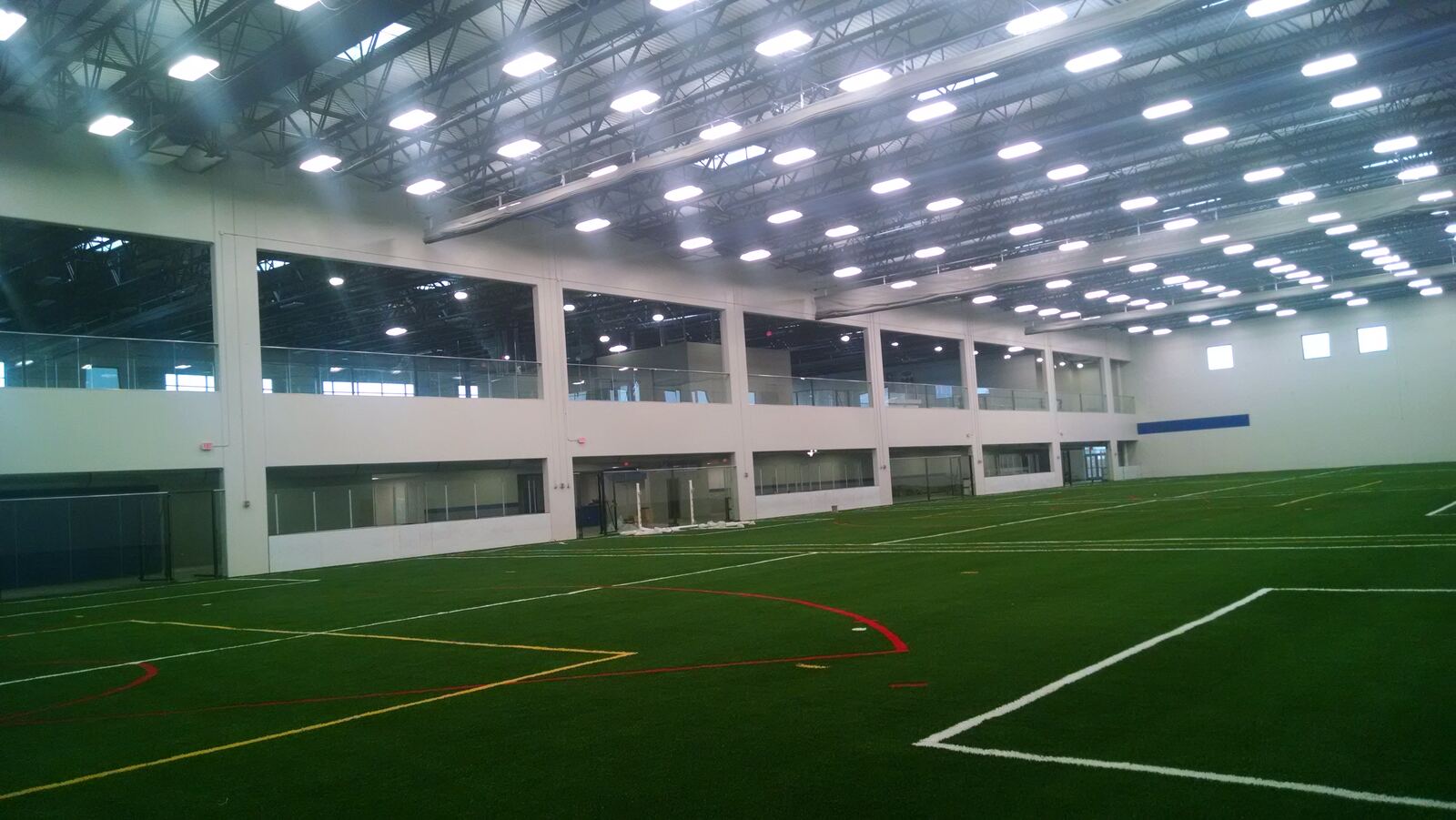 Indoor turf fields with high-bay lighting at Naperville Yard