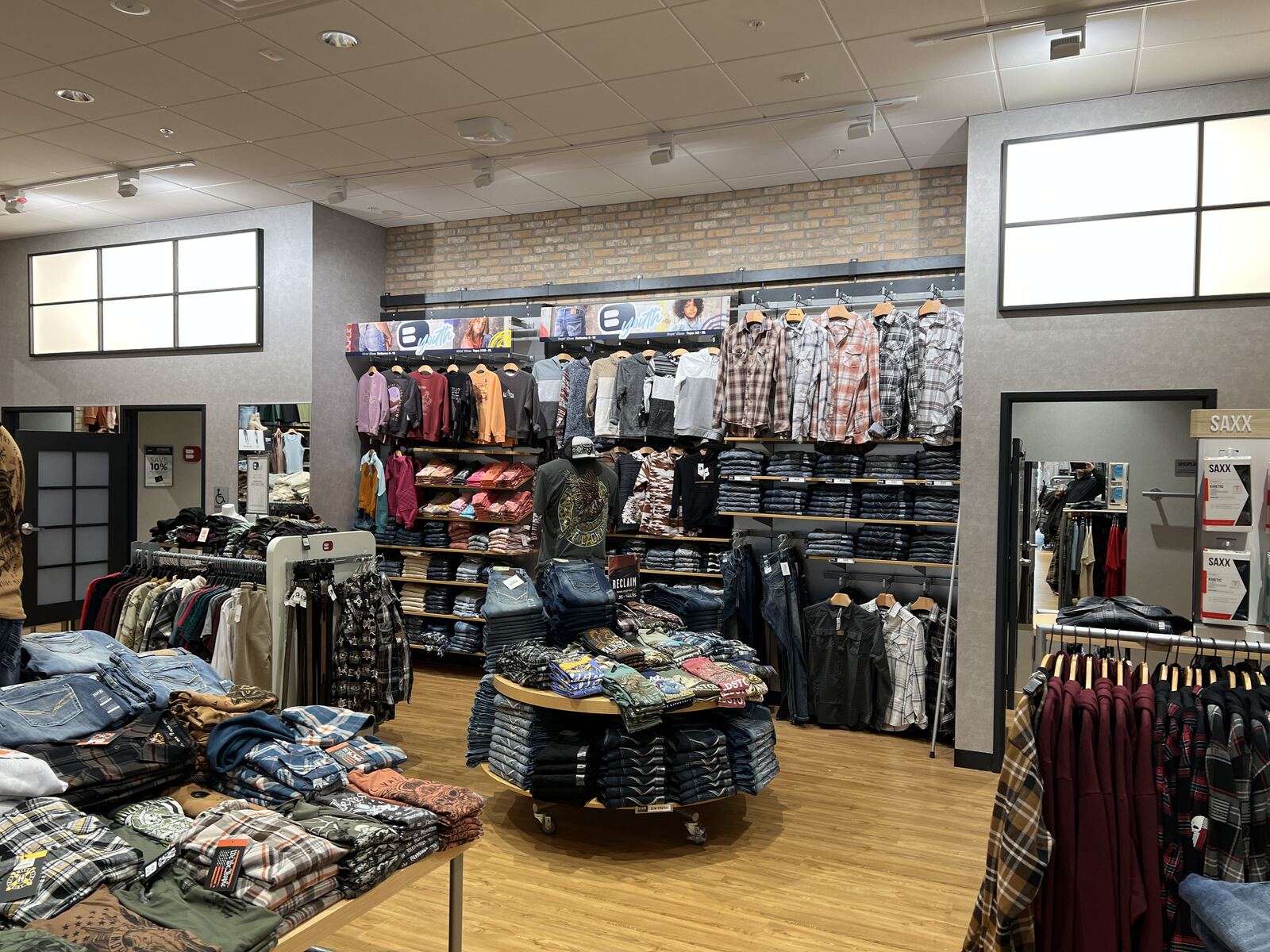 Clothing retail store buildout with track and accent lighting