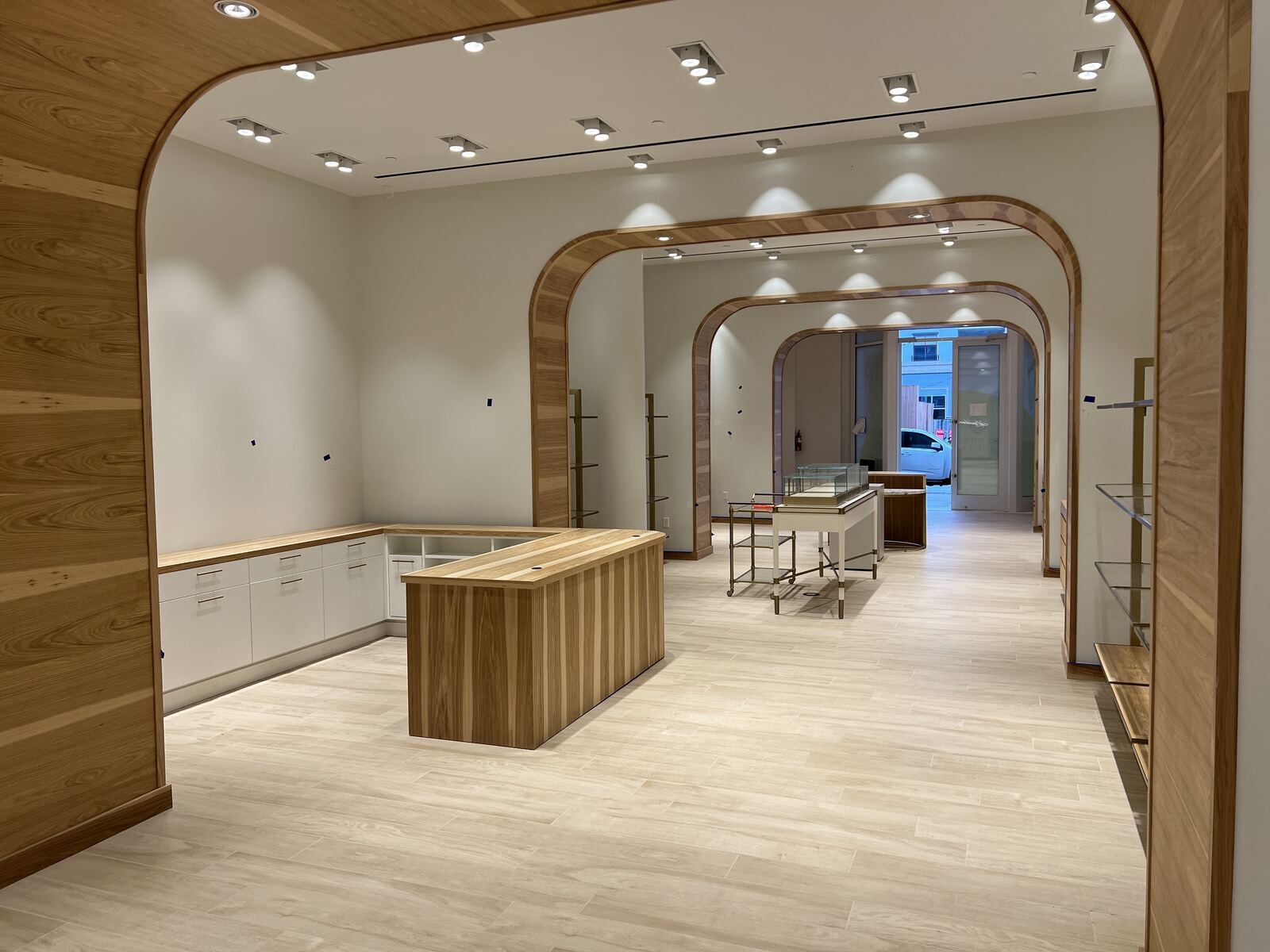 Retail interior with wood arches and recessed accent lighting