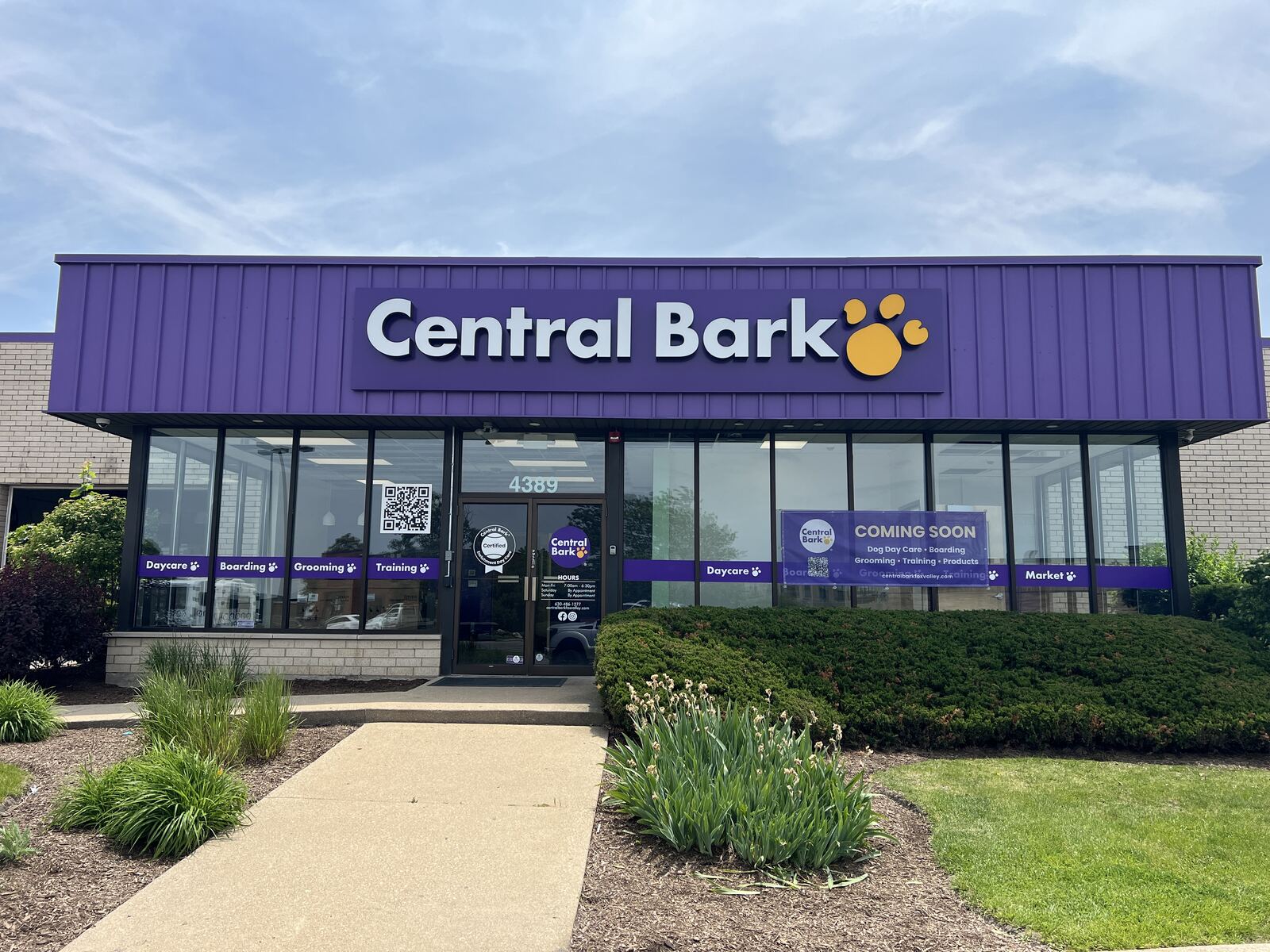 Pet care facility storefront with illuminated exterior signage